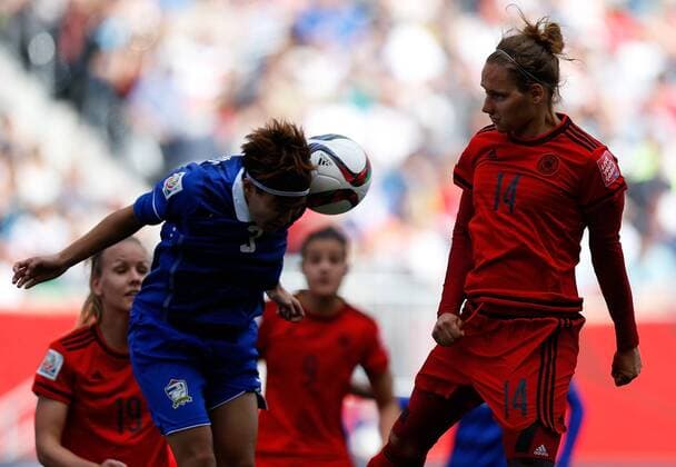 (150616) -- WINNIPEG, June, 2015 -- Babett Peter (R) of Germany vies with Natthakarn Chinwong of Thailand during their Group B match at the 2015 FIFA Women s World Cup in Winnipeg, Canada, June 15, 2015. Germany won 4-0. ) (SP)CANADA-WINNIPEG-FIFA WOMEN S WORLD CUP-GROUP B-GER VS THA WangxLili 