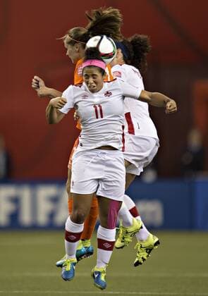 MONTREAL, June 15, 2015 -- Desiree Scott (front) of Canada heads the ball during the group A match against the Netherlands at the 2015 FIFA Women s World Cup in Montreal, Canada, on June 15, 2015. The match ended with a 1-1 draw. ) (SP)CANADA-MONTREAL-FIFA-WOMEN S-WORLD-CUP-CANADA VS NETHERLANDS AndrewxSoong 