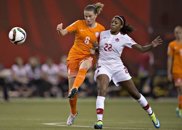 MONTREAL, June 15, 2015 -- Sherida Spitse (L) of the Netherlands vies with Ashley Lawrence of Canada during their group A match at the 2015 FIFA Women s World Cup in Montreal, Canada, on June 15, 2015. The match ended with a 1-1 draw. ) (SP)CANADA-MONTREAL-FIFA-WOMEN S-WORLD-CUP-CANADA VS NETHERLANDS AndrewxSoong 