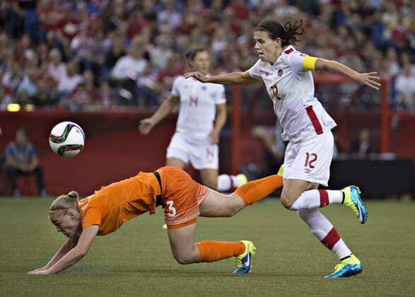 MONTREAL, June 15, 2015 -- Stefanie Van Der Gragt (L) of the Netherlands vies with Christine Sinclair of Canada during their group A match at the 2015 FIFA Women s World Cup in Montreal, Canada, on June 15, 2015. The match ended with a 1-1 draw. ) (SP)CANADA-MONTREAL-FIFA-WOMEN S-WORLD-CUP-CANADA VS NETHERLANDS AndrewxSoong 