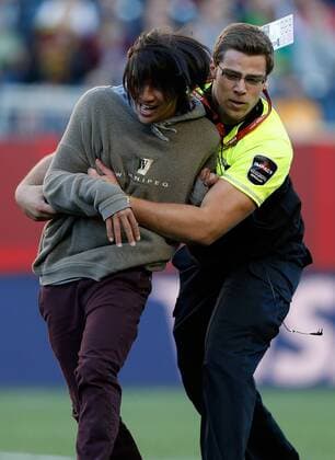 WINNIPEG, June 15, 2015 -- An intruder is expelled during the Group A match between China and New Zealand at the Winnipeg Stadium in Winnipeg, Canada, on June 15, 2015. The match ended with a 2-2 draw. China advanced to the round of 16. ) (SP)CANADA-WINNIPEG-FIFA WOMEN S WORLD CUP-CHN VS NZL WangxLili 