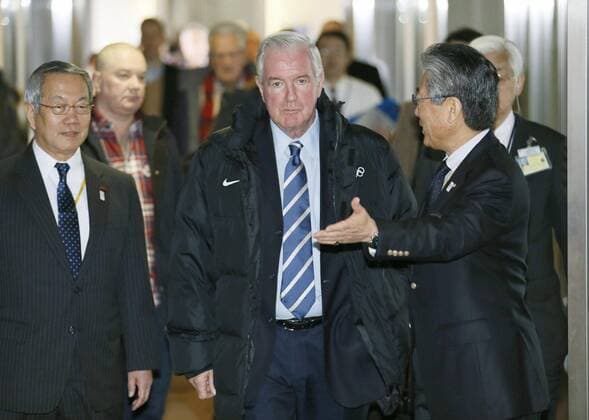 NARITA, Japan - Craig Reedie (C), vice president of the International Olympic Committee and head of the IOC s Evaluation Commission, arrives at Narita airport near Tokyo on March 1, 2013, for an on-site inspection of Tokyo s bid to host the 2020 Games. To the right is Japanese Olympic Committee President Tsunekazu Takeda.  0301022