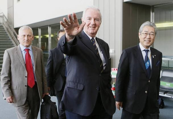 NARITA, Japan - Craig Reedie (C), chairman of the International Olympic Committee s Evaluation Commission, leaves Narita airport near Tokyo on March 8, 2013, wrapping up a four-day visit to evaluate Tokyo s bid to host the 2020 Summer Olympics. To the right is Japanese Olympic Committee President Tsunekazu Takeda.  0308019