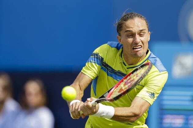 16.06.2015. London, England. Queens Aegon Championship Tennis. Rafa Nadal (ESP) versus Alexandr Dolgopolov (UKR), 1st round match. Alexandr Dolgopolov in action xCraigxMercerx  ActionPlus11632039