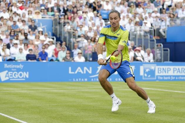 16.06.2015. London, England. Queens Aegon Championship Tennis. Rafa Nadal (ESP) versus Alexandr Dolgopolov (UKR), 1st round match. Alexandr Dolgopolov in action xCraigxMercerx  ActionPlus11632046