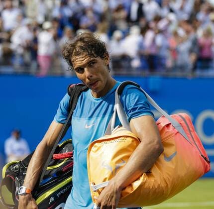 16.06.2015. London, England. Queens Aegon Championship Tennis. Rafa Nadal (ESP) versus Alexandr Dolgopolov (UKR), 1st round match. Rafa Nadal looks dejected as he leaves the court having lost xCraigxMercerx  ActionPlus11632049