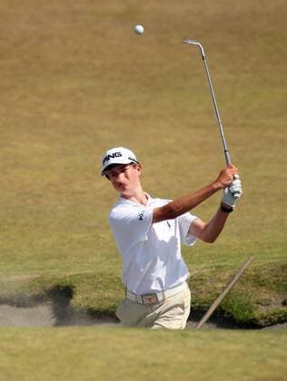 15-year-old Cole Hammer, from Houston hits out of a sand trap onto the 5th green during a practice round prior to the start of the 115th U.S. Open Championship at Chambers Bay on June 16, 2015 in University Place, Washington.  SEA20150616127 JIMxBRYANT