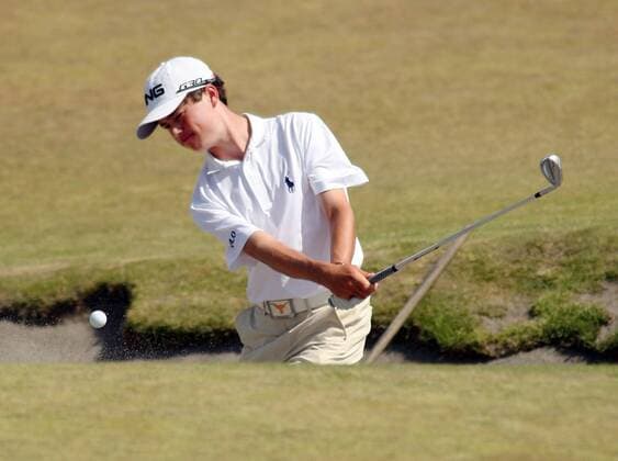 15-year-old Cole Hammer, from Houston hits out of a sand trap onto the 5th green during a practice round prior to the start of the 115th U.S. Open Championship at Chambers Bay on June 16, 2015 in University Place, Washington.  SEA20150616128 JIMxBRYANT