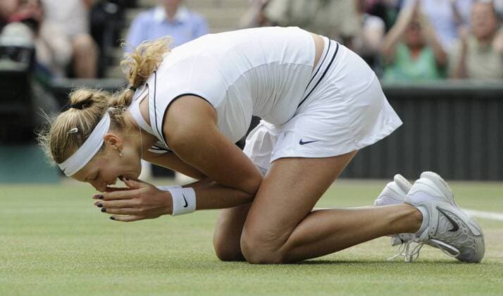 LONDON, Britain - Petra Kvitova of the Czech Republic kneels down in joy after winning the women s singles final of the Wimbledon Championships at the All England Club in southwest London on July 2, 2011. Kvitova captured her first Wimbledon title by defeating former champion Maria Sharpova of Russia 6-3, 6-4.  0703002