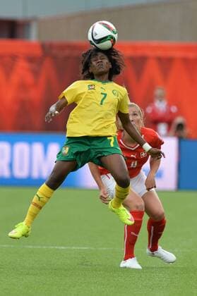 16 JUNE 2015: Cameroon s Gabrielle Onguene (7) heads the ball against Switzerland at the FIFA Womens World Cup at Commonwealth Stadium in Edmonton, Alberta, Canada. SOCCER: JUN 16 FIFA Women s World Cup - Group C - Switzerland v Cameroon Icon20150611001 EDITORIAL USE ONLY