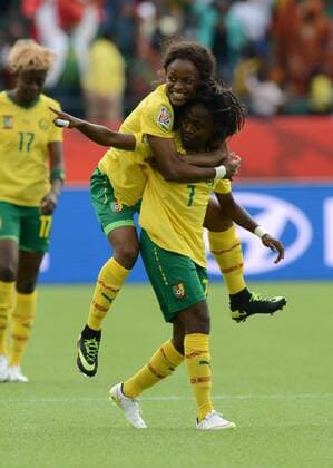 16 JUNE 2015: Cameroon s Gabrielle Onguene (7) celebrates with Jeannette Yango (10) after scoring the first goal against Switzerland at the FIFA Womens World Cup at Commonwealth Stadium in Edmonton, Alberta, Canada. SOCCER: JUN 16 FIFA Women s World Cup - Group C - Switzerland v Cameroon Icon20150611009 EDITORIAL USE ONLY