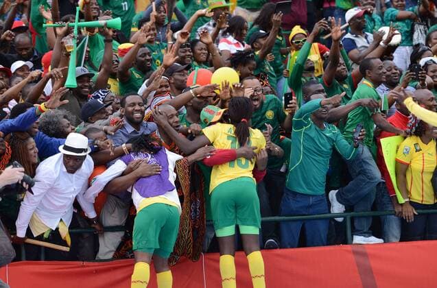 EDMONTON, June 16, 2015 -- Players of Cameroon celebrate with fans after winning the group C match against Switzerland at the 2015 FIFA Women s World Cup in Edmonton, Canada, June 16, 2015. Cameroon won 2-1 and was qualified for the round of 16. ) (SP)CANADA-EDMONTON-FIFA WOMEN S WORLD CUP-GROUP A-SWITZERLAND VS CAMEROON WangxYuguo 