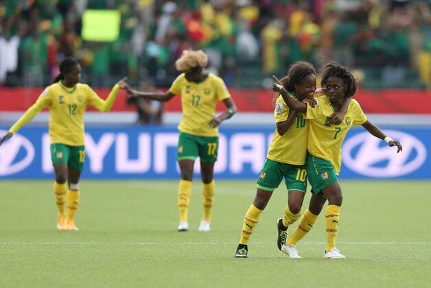 EDMONTON, June 16, 2015 -- Gabrielle Onguene (1st R) of Cameroon celebrates for score during the group C match against Switzerland at the 2015 FIFA Women s World Cup in Edmonton, Canada, June 16, 2015. Cameroon won 2-1 and was qualified for the round of 16. ) (SP)CANADA-EDMONTON-FIFA WOMEN S WORLD CUP-GROUP A-SWITZERLAND VS CAMEROON QinxLang 