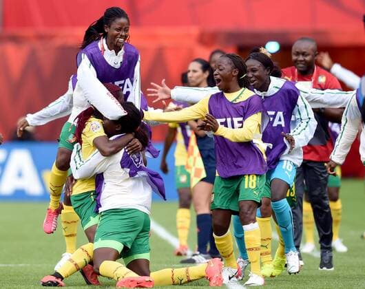 EDMONTON, June 16, 2015 -- Players of Cameroon celebrate for score during the group C match against Switzerland at the 2015 FIFA Women s World Cup in Edmonton, Canada, June 16, 2015. Cameroon won 2-1 and was qualified for the round of 16. ) (SP)CANADA-EDMONTON-FIFA WOMEN S WORLD CUP-GROUP A-SWITZERLAND VS CAMEROON WangxYuguo 