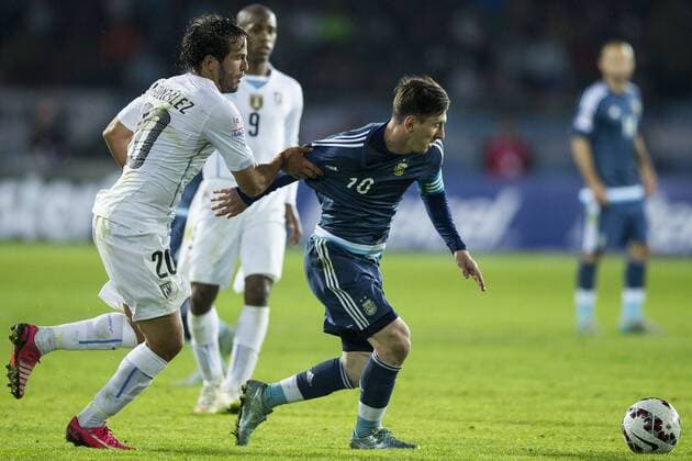 LA SERENA, June 16, 2015 -- Lionel Messi (R) of Argentina vies with Alvaro Gonzalez of Uruguay during their Group B match at the 2015 American Cup, at La Portada stadium, in La Serena, Chile, on June 16, 2015. Argentina won 1-0. ) (ce) (SP)CHILE-LA SERENA-COPA AMERICA-ARGENTINA VS URUGUAY LuisxEcheverria 