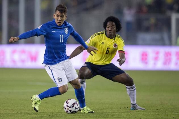Brazil vs Colombia SANTIAGO, SC - 17 06 2015: BRAZIL X COLOMBIA - Roberto Firmino from Brazil and C. Sanchez of Colombia during the match between Brazil vs Colombia, valid for the second round of the first phase of Group C of the Copa America 2015 held at the Estadio Monumental David Arellano . (Photo: Marcelo Machado de Melo FotoArena)  MarceloxMachadoxdexMelo