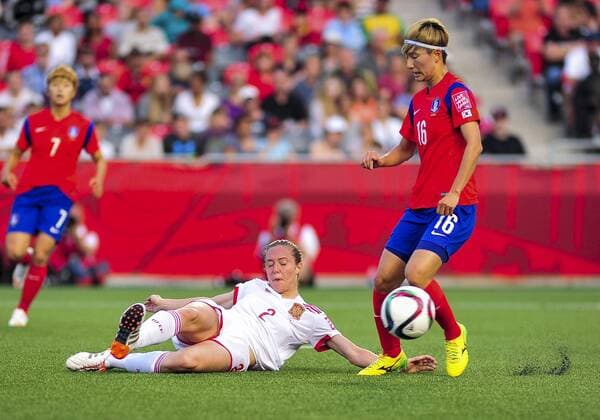 June 17, 2015: Defender Cecila Jimenez ( 2) of Spain executes a perfectly timed sliding tackle on Kang Yumi ( 16) of Korea Republic during the FIFA 2015 Women s World Cup Group E match between Korea and Spain at Lansdowne Stadium in Ottawa, Canada. SOCCER: JUN 17 FIFA Women s World Cup - Group E - Korea v Spain Icon15061700005 EDITORIAL USE ONLY