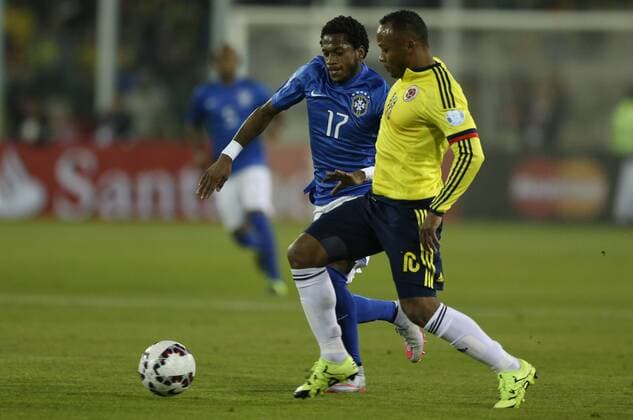 SANTIAGO, June 17, 2015 -- Fred (L) of Brazil vies for the ball with Juan Zuniga of Colombia during the Group C match of the Copa America Chile 2015, at the Estadio Monumental, in Santiago, Chile, on June 17, 2015. ) (ce) (SP)CHILE-SANTIAGO-COPA AMERICA-BRAZIL VS COLOMBIA JorgexVillegas 