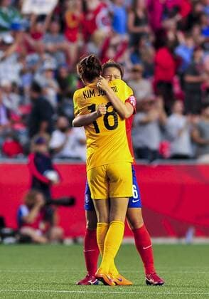 June 17, 2015: Goalkeeper Kim Jungmi ( 18) and Hwang Boram ( 6) of Korea Republic embrace after a Korea goal during the FIFA 2015 Women s World Cup Group E match between Korea and Spain at Lansdowne Stadium in Ottawa, Canada. Korea recovered from a 1-0 deficit at half time to win 2-1 and progress to the knockout stages. SOCCER: JUN 17 FIFA Women s World Cup - Group E - Korea v Spain Icon15061700018 EDITORIAL USE ONLY