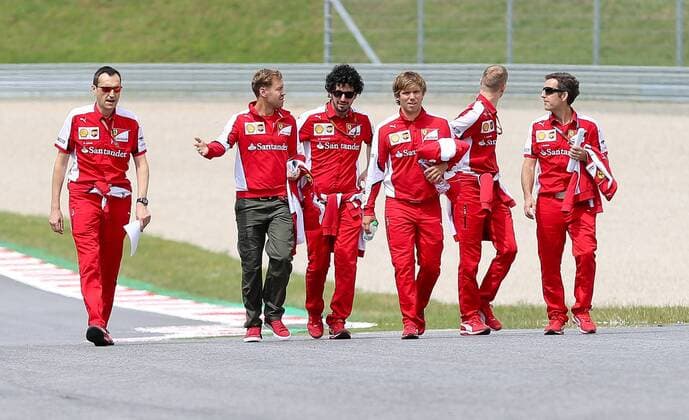 FORMULA 1 - GP of Austria 2015 SPIELBERG,AUSTRIA,18.JUN.15 - MOTORSPORTS, FORMULA 1 - Grand Prix of Austria, Red Bull Ring, preview. Image shows Sebastian Vettel (GER Scuderia Ferrari) with team members. GEPAxpictures xChristianxWalgram
