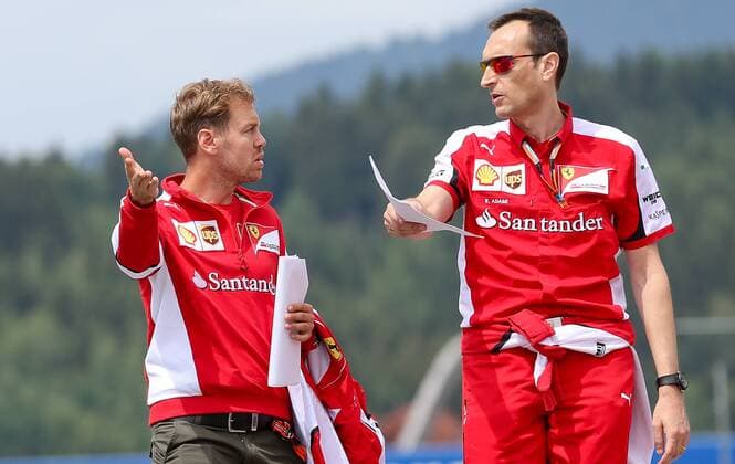FORMULA 1 - GP of Austria 2015 SPIELBERG,AUSTRIA,18.JUN.15 - MOTORSPORTS, FORMULA 1 - Grand Prix of Austria, Red Bull Ring, preview. Image shows Sebastian Vettel (GER Scuderia Ferrari) with a team member. GEPAxpictures xChristianxWalgram