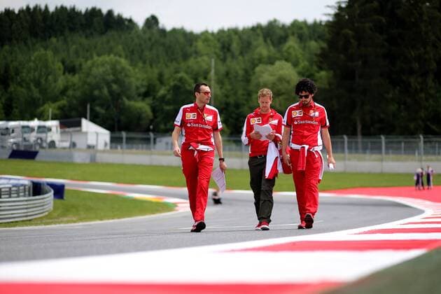 FORMULA 1 - GP of Austria 2015 SPIELBERG,AUSTRIA,18.JUN.15 - MOTORSPORTS, FORMULA 1 - Grand Prix of Austria, Red Bull Ring, preview. Image shows Sebastian Vettel (GER Ferrari) and team members. GEPAxpictures xDanielxGoetzhaber