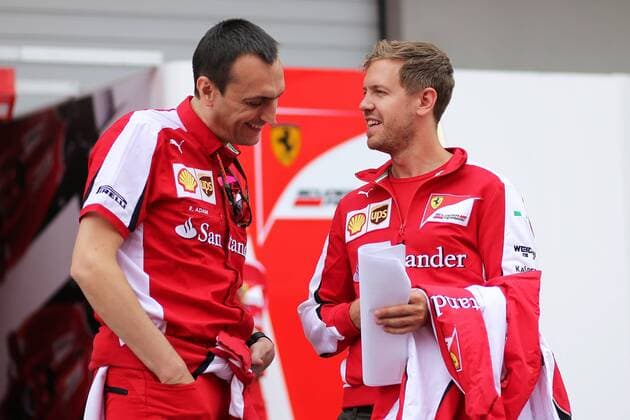 FORMULA 1 - GP of Austria 2015 SPIELBERG,AUSTRIA,18.JUN.15 - MOTORSPORTS, FORMULA 1 - Grand Prix of Austria, Red Bull Ring, preview. Image shows Sebastian Vettel (GER Ferrari) and team member. GEPAxpictures xDanielxGoetzhaber