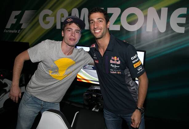 FORMULA 1 - GP of Austria 2015 SPIELBERG,AUSTRIA,18.JUN.15 - MOTORSPORTS, FORMULA 1 - Grand Prix of Austria, Red Bull Ring, preview. Image shows Hakki jr. and Daniel Ricciardo (AUS Infiniti Red Bull Racing) at the gamezone. GEPAxpictures xHaraldxSteiner