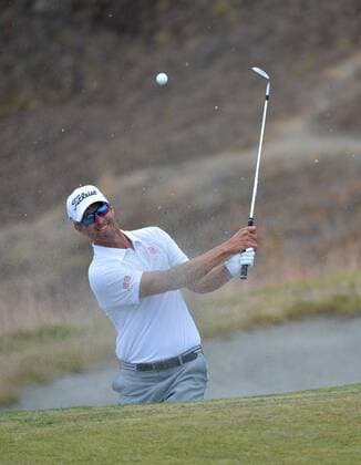Adam Scott of Australia hits out of the sand on the ninth hole in round one of the 115th U.S. Open Championship at Chambers Bay on June 18, 2015 in University Place, Washington.  SEA20150618280 KEVINxDIETSCH