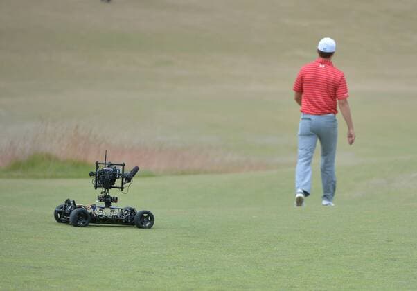 Jordan Spieth is followed by a TV robot on the first hole of round one of the 115th U.S. Open Championship at Chambers Bay on June 18, 2015 in University Place, Washington.  SEA20150618286 KEVINxDIETSCH