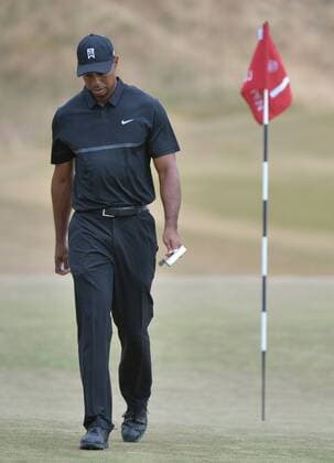 Tiger Woods walks off the green on the first hole of round one of the 115th U.S. Open Championship at Chambers Bay on June 18, 2015 in University Place, Washington.  SEA20150618293 KEVINxDIETSCH