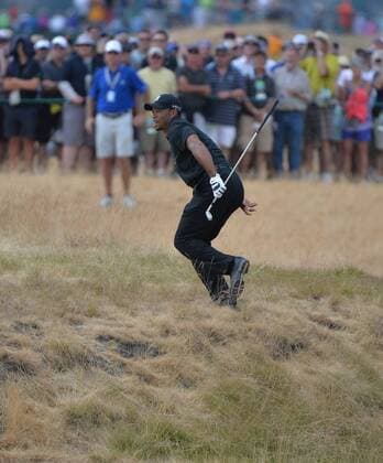 Tiger Woods runs up a hill to watch his tee shot on the sixth hole of round one of the 115th U.S. Open Championship at Chambers Bay on June 18, 2015 in University Place, Washington.  SEA201506182106 KEVINxDIETSCH