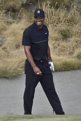 June 18, 2015..Tiger Woods reacts after his ball rolled close to the hole and lead to an improbable up and down save from a plugged lie in a bunker next to the10th green during round 1 at the U.S. Open at Chambers Bay, University Place, Washington. . .George Holland Cal Media PGA Golf Herren Tour 2015: US Open Round 1 JUN 18 - ZUMAch4_
