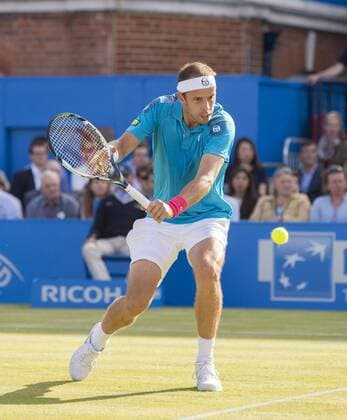 19.06.2015. London, England. Queens Aegon Championship Tennis. Gilles Muller (LUX) comes forward to play a low reverse backhand in his quarterfinal match with Andy Murray (GBR). xNigelxCookex  ActionPlus11633327