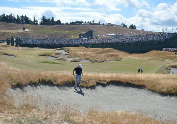 Jordan Spieth drops into the sand to play his ball on the 18th hole in the second round of the 115th U.S. Open Championship at Chambers Bay on June 19, 2015 in University Place, Washington.  SEA20150619021 KEVINxDIETSCH