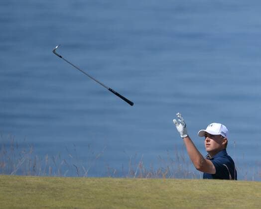 Jordan Spieth tosses a club to his caddie on the 16th hole in the second round of the 115th U.S. Open Championship at Chambers Bay on June 19, 2015 in University Place, Washington.  SEA20150619022 KEVINxDIETSCH