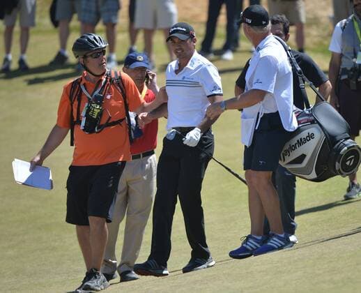Jason Day of Australia is helped by paramedics and caddie Colin Swatton after collapsing on the ninth hole, his last of the day, in the second round of the 115th U.S. Open Championship at Chambers Bay on June 19, 2015 in University Place, Washington. Day recovered to putt out and finish his round.  SEA20150619037 KEVINxDIETSCH