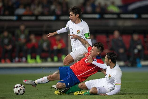 X Chile Bolivia SANTIAGO, CHILE - 06 19 2015: CHILE X BOLIVIA - Mat?as Fernandez of Chile dispute ball R. Raldes in Bolivia and C. Coimbra Bolivia during match between Chile x Bolivia, valid for the third round of the first phase of Group A of the Copa America 2015 held at the National Stadium Julio Mart?nez Pr?danos. (Photo: Marcelo Machado de Melo FotoArena)  MarceloxMachadoxdexMelo