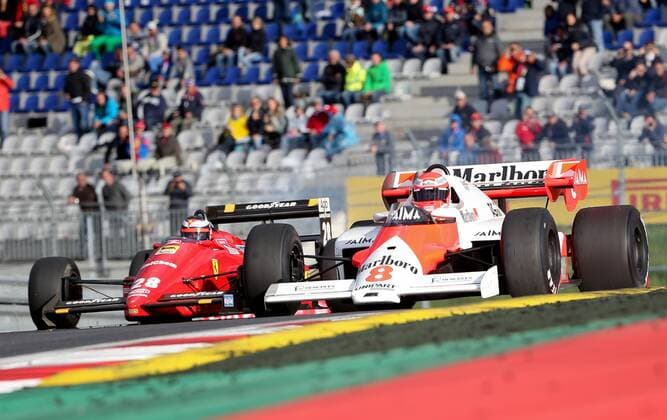 FORMULA 1 - GP of Austria 2015 SPIELBERG,AUSTRIA,20.JUN.15 - MOTORSPORTS, FORMULA 1 - Grand Prix of Austria, Red Bull Ring, legends race. Image shows chairman of the advisory board Niki Lauda (Mercedes GP) in the 1984 McLaren MP 4 2 TAG Turbo and Gerhard Berger in the 1988 Ferrari F188C. GEPAxpictures xChristianxWalgram