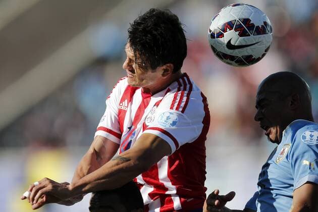 Football , Uruguay v Paraguay. Copa America Championship 2015 . Paraguay s player Nelson Haedo Valdez, center, battles for the ball against Egidio Arevalo of Uruguay during the group B football match of the 2015 Copa America at the La Portada stadium in Santiago.. 20 06 2015 Andres Pina Photosport Uruguay v Paraguay, Copa America 2015. 