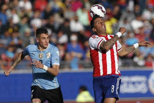 Football , Uruguay v Paraguay Copa America 2015 . Paraguay s Lucas Barrios, right, battles for the ball agains Jose Maria Jimenez of Uruguay during the match of group B of the 2015 Copa America at La Serena stadium. Rancagua, Chile. 20 06 2015 Marcelo Hernandez Photosport Uruguay v Paraguay, Copa America 2015. 