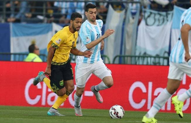 Football , Argentina v Jamaica Copa America 2015 . Argentina s player Javier Pastore battles for the ball against Joel McAnuff of Jamaica during the group B of the 2015 Copa America football match held at the Sausalito stadium in Vina del Mar, Chile. 20 06 2015 Jonathan Mancilla Photosport Argentina v Jamaica, Copa America 2015. 