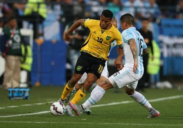 Football , Argentina v Jamaica Copa America 2015 . Argentina s player Marcos Rojo battles for the ball against Joel McAnuff of Jamaica during the group B of the 2015 Copa America football match held at the Sausalito stadium in Vina del Mar, Chile. 20 06 2015 Jonathan Mancilla Photosport Argentina v Jamaica, Copa America 2015. 