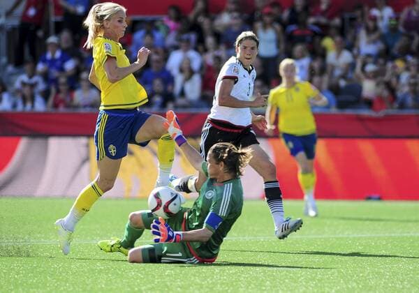 June 20, 2015: Goalkeeper Nadine Angerer ( 1) of Germany rushes out of her goal to close down Sofia Jakobsson ( 10) of Sweden during the FIFA 2015 Women s World Cup Round of 16 match between Germany and Sweden at Lansdowne Stadium in Ottawa, Canada. Germany won 4-1 to progress to the quarter-finals whilst Sweden are eliminated. SOCCER: JUN 20 FIFA Women s World Cup - Round of 16 - Germany v Sweden Icon2015062000008 EDITORIAL USE ONLY