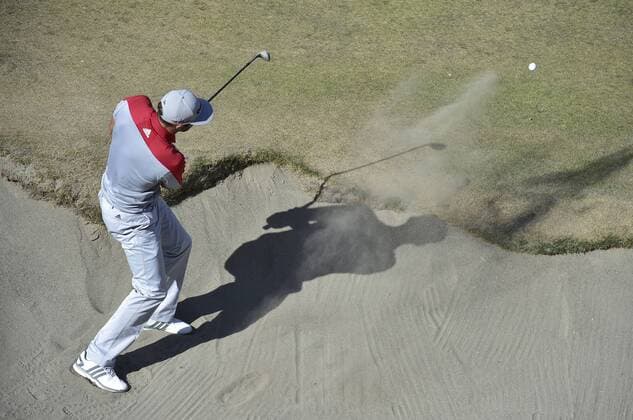 June 20, 2015..Dustin Johnson hits his 3rd shot from a 10th hole green side bunker during round 3 at the U.S. Open at Chambers Bay, University Place, Washington. . .George Holland Cal Media PGA Golf Herren Tour 2015: US Open Round 3 JUN 20 - ZUMAch4_