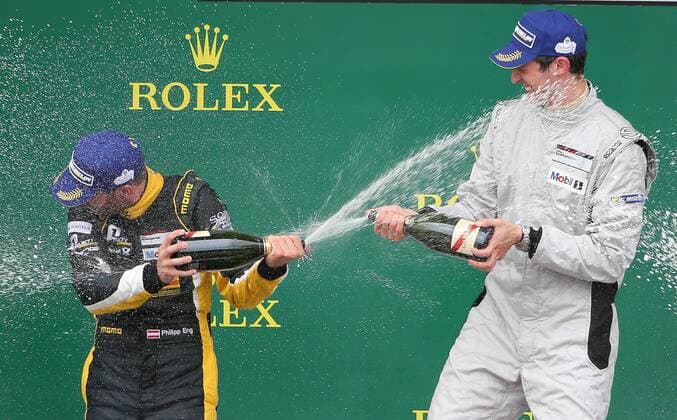 MOTORSPORTS - Porsche Super Cup 2015 SPIELBERG,AUSTRIA,21.JUN.15 - MOTORSPORTS - Porsche Supercup, Red Bull Ring, award ceremony. Image shows the rejoicing of Philipp Eng (AUT) and Christopher Zoechling (GER). Keywords: champagne. GEPAxpictures xChristianxWalgram