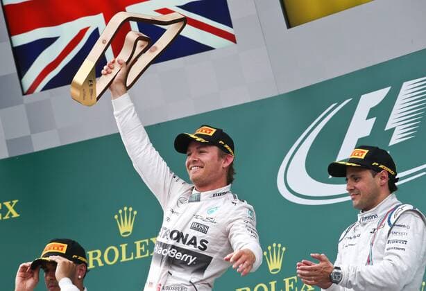 FORMULA 1 - GP of Austria 2015 SPIELBERG,AUSTRIA,21.JUN.15 - MOTORSPORTS, FORMULA 1 - Grand Prix of Austria, Red Bull Ring, award ceremony. Image shows rejoicing of Nico Rosberg (GER Mercedes GP) and Felipe Massa (BRA Williams F1). Keywords: trophy. GEPAxpictures xWolfgangxGrebien