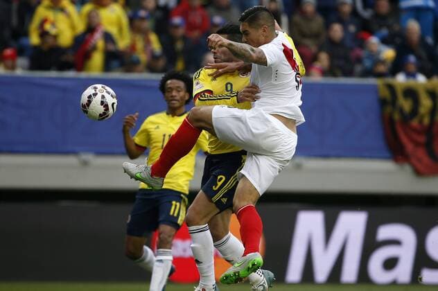 Football, Colombia v Peru. Copa America 2015. Colombia s player Ramadel Falcao, left, battles for the ball against Juan Vargas of Peru during the Copa America Group C, at German Becker stadium. Temuco. 21 06 2015 DragomirYankovic Photosport Colombia v Peru, Copa America 2015. 