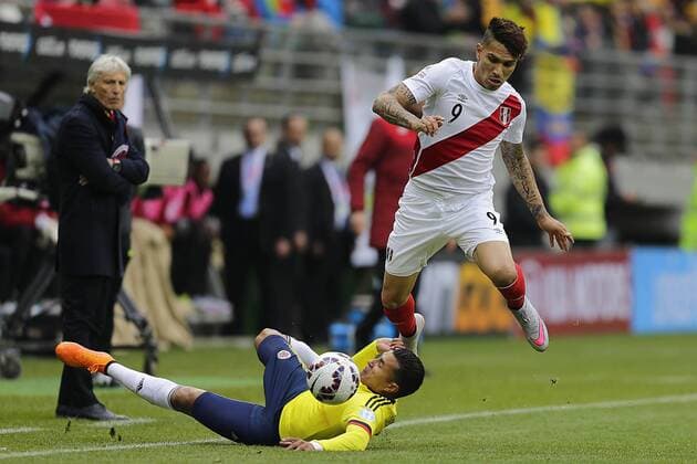 Football, Colombia v Peru. Copa America 2015. Peru s player José Paolo Guerrero, right, play the ball against Colombia during the Copa America Group C, at German Becker stadium. Temuco. 21 06 2015 AlejandroZonez Photosport Colombia v Peru, Copa America 2015. 