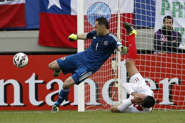Football, Colombia v Peru. Copa America 2015. Colombia s goalkeeper David Ospina, center, battles for the ball against Carlos Zambrano of Peru during the Copa America Group C, at German Becker stadium. Temuco. 21 06 2015 DragomirYankovic Photosport Colombia v Peru, Copa America 2015. 